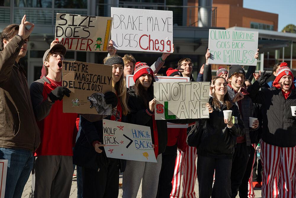 Students cheer as they hold up their signs before College GameDay outside Talley Student Union on Sunday, Feb. 23, 2025. Students lined up starting as early as 6:30 AM.
