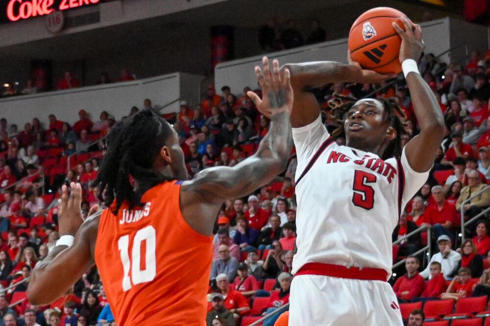 Freshman guard Trey Parker takes a shot at the net during the game against Clemson in the Lenovo Center on Saturday, Feb. 1, 2025. The Wolfpack lost to the Tigers 68-58.