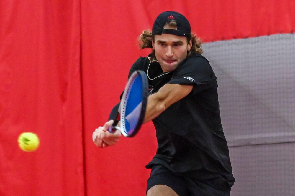 Junior Martin Borisiouk backhands the ball in his doubles game with senior Luca Staeheli against NC Central at the J.W. Isenhour Tennis Center&#160;on Saturday, Jan. 18, 2025. Borisiouk and Staeheli won their doubles match 5-3 (unfinished). NC State won the match 7-0.