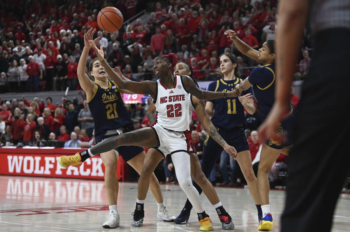 Senior guard Saniya Rivers reaches for a rebound during the game against the Notre Dame Fighting Irish in Reynolds Coliseum on Sunday, Feb. 23, 2025. Rivers scored 14 points and recorded nine assists, three blocks and two steals. The Wolfpack beat the number one ranked Fighting Irish in double overtime 104-95.