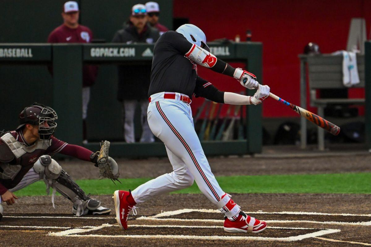 Sophomore infielder Matt Ossenfort swings at the ball during the game against Fordham on Feb. 15, 2025 at Doak Field at Dail Park. Ossenfort scored one run and had one hit. The Wolfpack defeated the Rams 19-6.