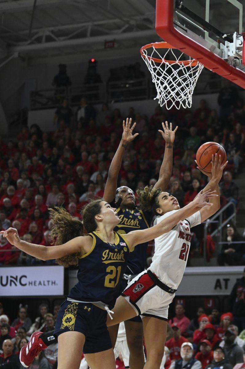 Graduate guard Madison Hayes goes up for a contested lay up and is fouled during NC State's home game against the Notre Dame Fighting Irish in Reynolds Coliseum on Sunday, Feb. 23, 2025. Hayes scored 13 points. The Wolfpack beat the top ranked Fighting Irish in double overtime 104-95.