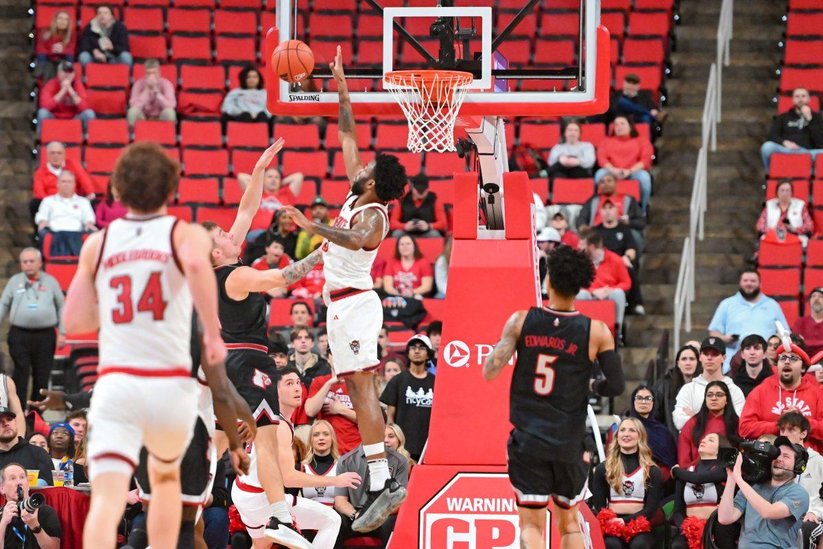 Senior guard/forward Dontrez Styles blocks shot during the game against University of Louisville at the Lenovo Center on Wednesday, Feb. 12, 2025. Styles scored five points and three rebounds. NC State lost 91-66.