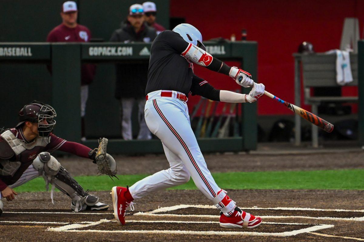 Sophomore infielder Matt Ossenfort swings at the ball during the game against Fordham on Feb. 15, 2025 at Doak Field at Dail Park. Ossenfort scored one run and had one hit. The Wolfpack defeated the Rams 19-6.