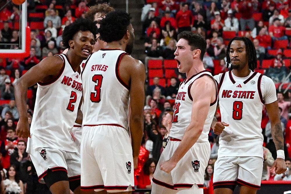 NC State players celebrate after going on an offensive run during the game against Wake Forest at the Lenovo Center on Saturday, Feb. 22, 2025. NC State defeated Wake Forest 85-73.