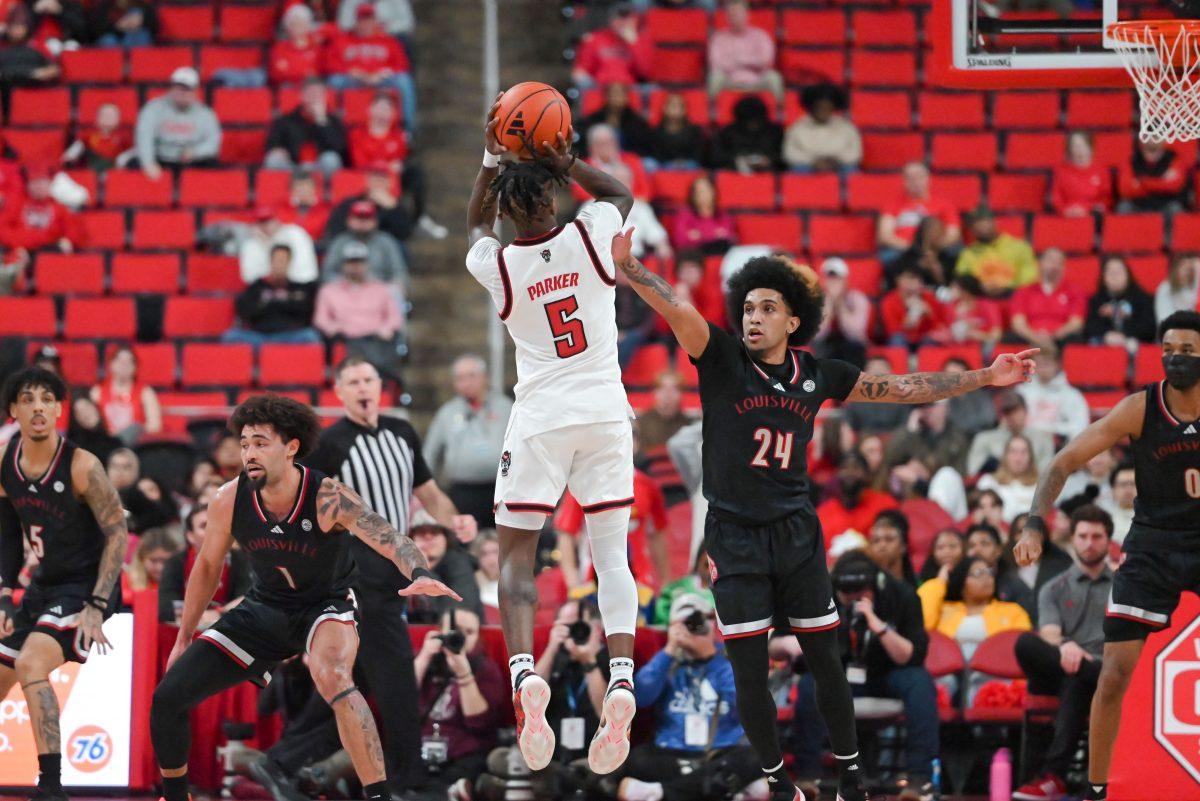 Freshman guard Trey Parker shoots a three-pointer during the game against University of Louisville at the Lenovo Center on Wednesday, Feb. 12, 2025. Parker led the team with 13 points. NC State lost 91-66.