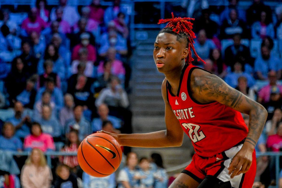 NC State guard Saniya Rivers dribbles down the court during the game against UNC on Sunday, Feb. 16, 2025, in Carmichael Arena. Rivers finished with 14 points and four assists. The Wolfpack fell to the Tar Heels 66-65.