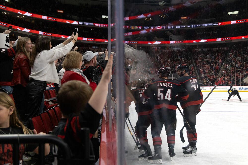 Carolina Hurricanes celebrate a goal with fans during the game versus Chicago Blackhawks at the Lenovo Center on Thursday, Jan 30, 2025. The Hurricanes beat the Blackhawks 3-2.