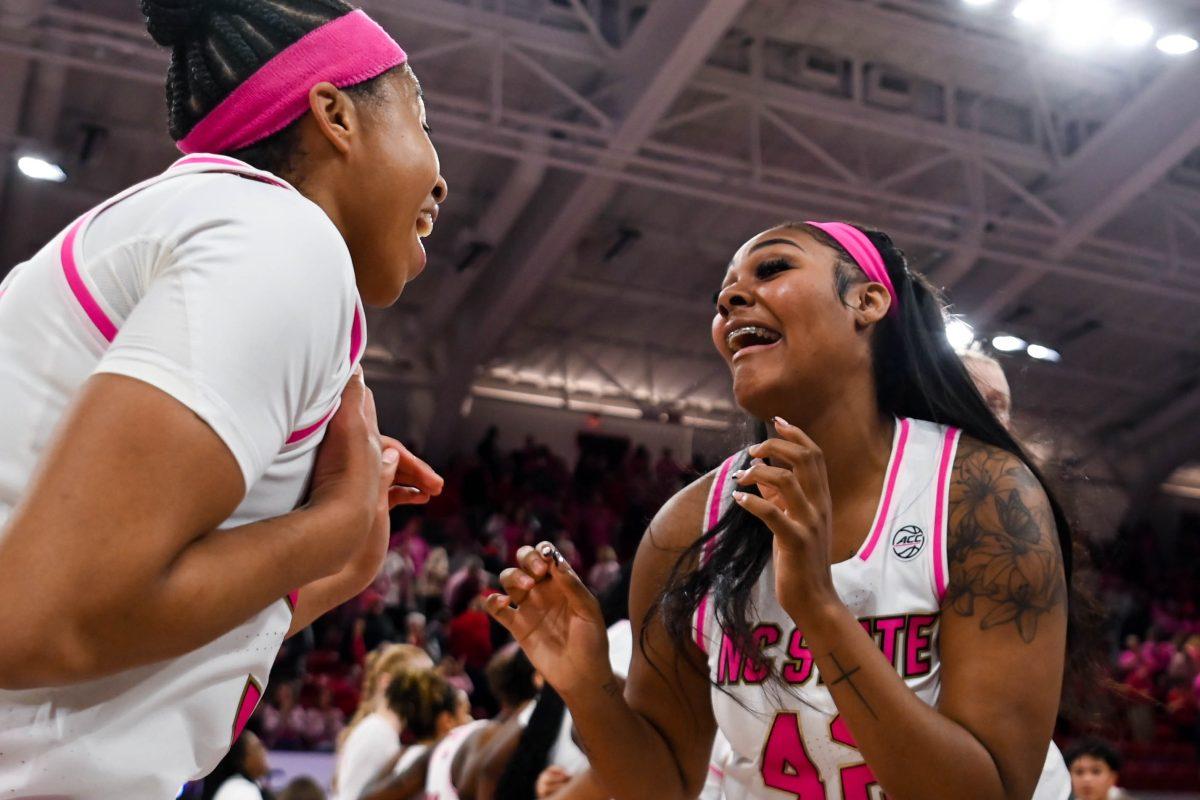 Sophomore guard Zoe Brooks and sophomore center Mallory Collier do a celebratory dance after winning the Play4Kay game against Duke at Reynolds Coliseum on Monday, Feb. 3, 2025. The Wolfpack beat the Blue Devils 89-83.