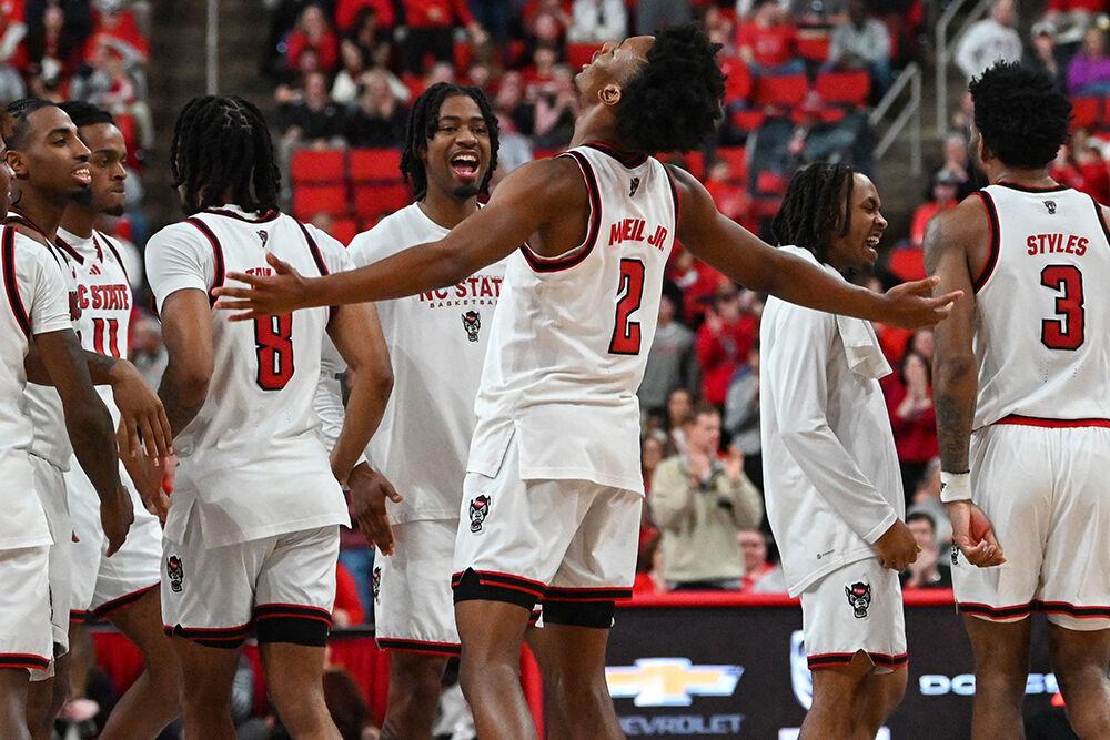NC State players celebrate as time expires during the game against Wake Forest at the Lenovo Center on Saturday, Feb. 22, 2025. NC State defeated Wake Forest 85-73.