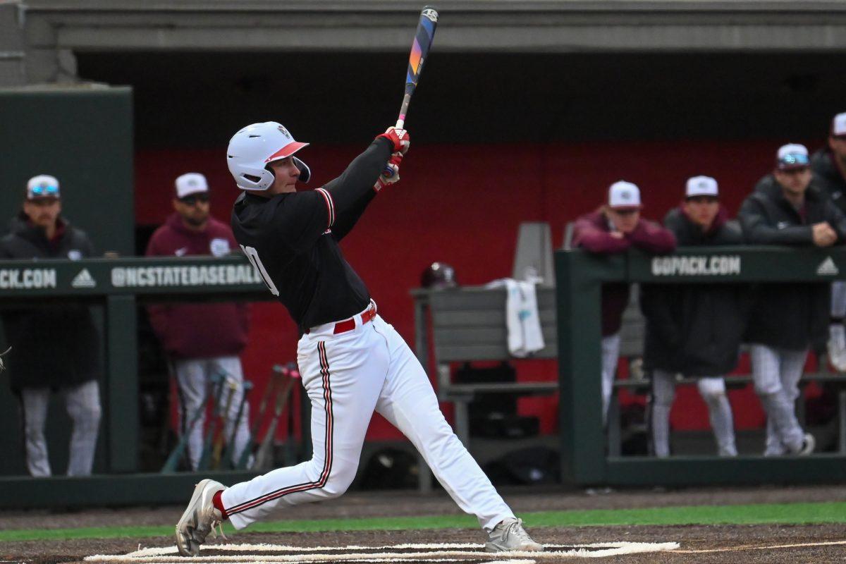 Sophomore infielder Ryan Jaros swings during the game against Fordham on Feb. 15, 2025 at Doak Field at Dail Park. Jaros had scored two runs and had two hits. The Wolfpack defeated the Rams 19-6.