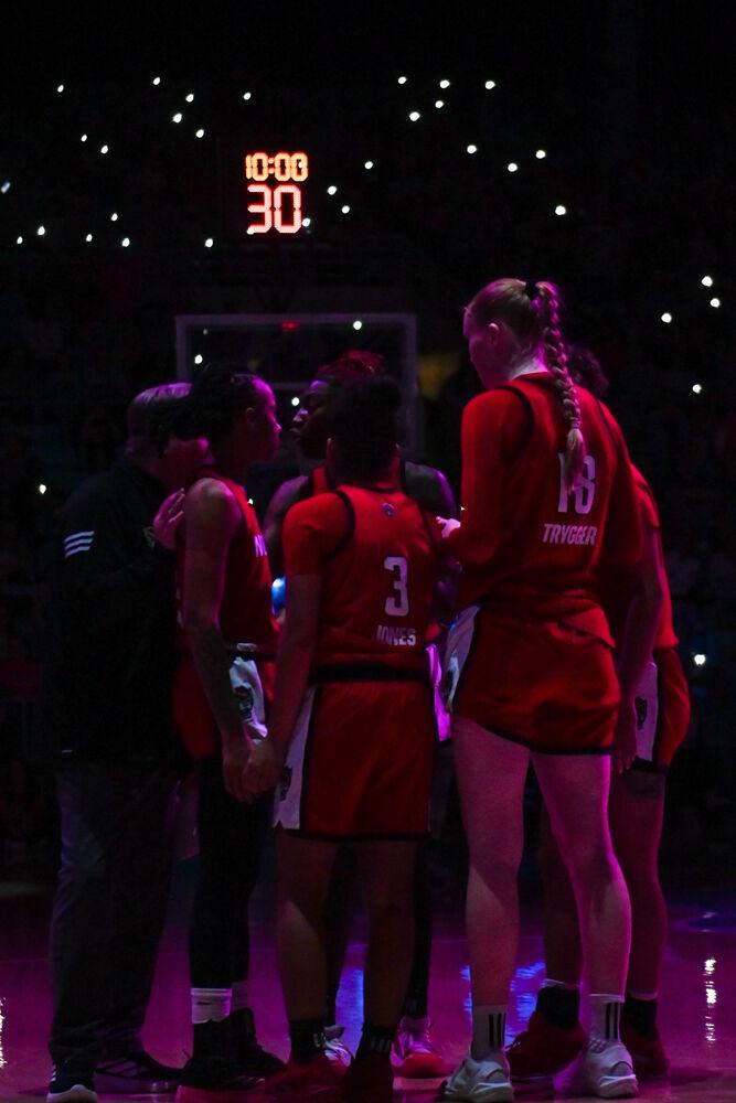 The NC State basketball team huddles during the game against UNC-Chapel Hill in Carmicheal Arena on Sunday, Feb. 16, 2025. NC State lost to Chapel Hill 66-65.