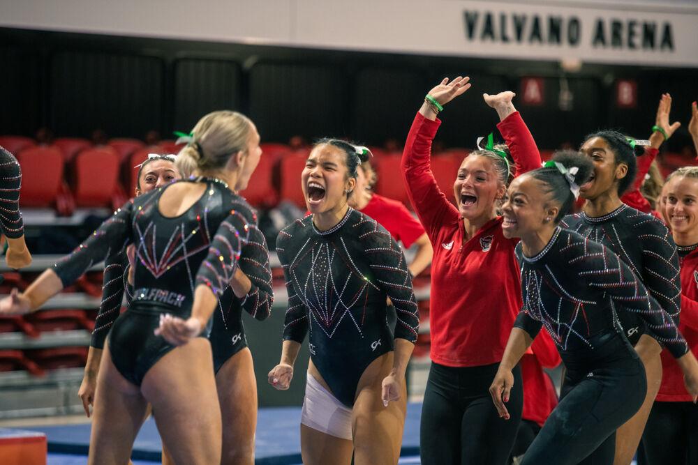 Sophomore Katie Harper celebrates with her teammates during the meet against California in Reynolds Coliseum on Sunday, Feb. 2, 2025. Harper scored 9.850 points on the balance beam. The Wolfpack lost to the Bears 197.175-196.550