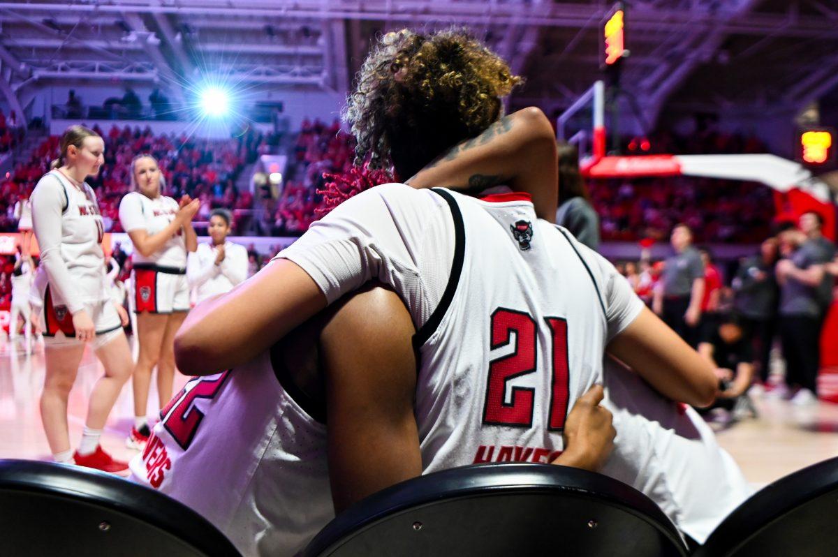 Senior guards Saniya Rivers, Madison Hayes, and Aziaha James share a hug before the game against Wake Forest in Reynolds Coliseum on Thursday, Feb. 27, 2025. The Wolfpack beat the Demon Deacons 78-57 on senior night.