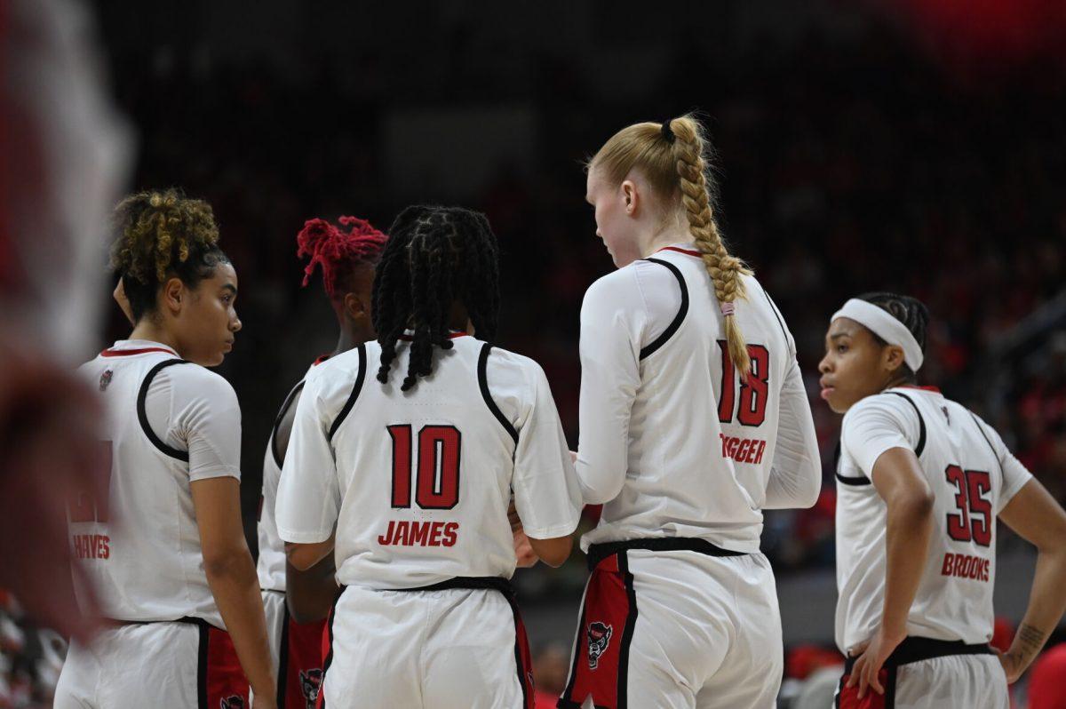 The NC State women's basketball team huddles up during the game against Notre Dame Fighting Irish in Reynolds Coliseum on Sunday, Feb. 23, 2025. Notre Dame hit a fourth quarter buzzer beater, but the Wolfpack beat the Fighting Irish 104-95 in double overtime.
