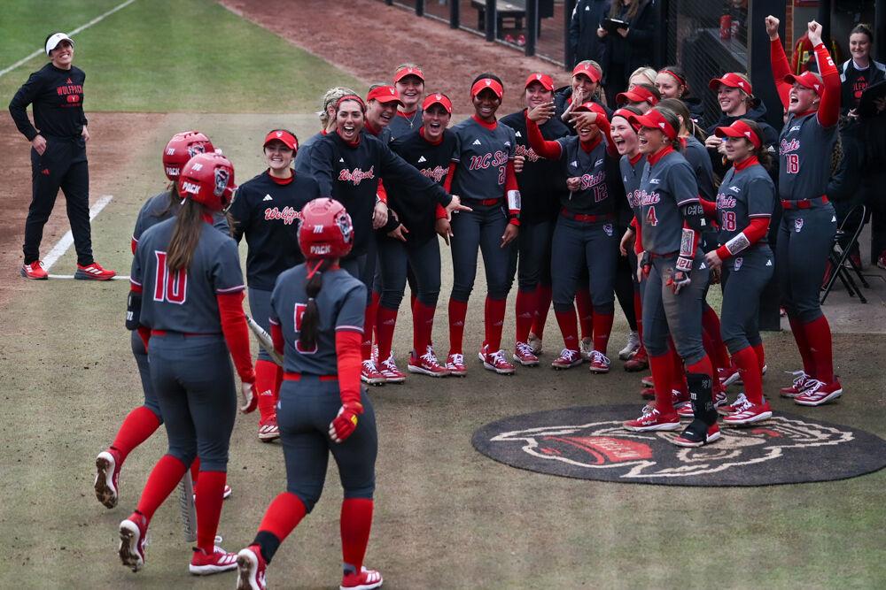 The NC State softball team welcomes three players who ran home during the game against Central Michigan at Dail Softball Stadium on Saturday, Feb. 22, 2025. NC State won the game 6-5.
