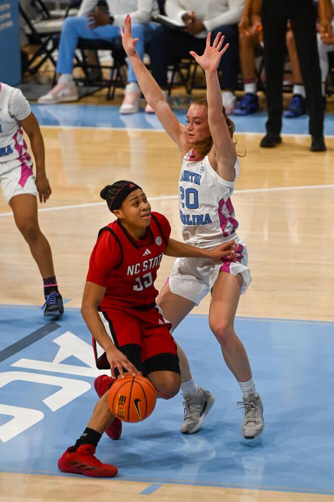 Sophomore guard Zoe Brooks attempts to drive the ball during the game against UNC-Chapel Hill in Carmicheal Arena on Sunday, Feb. 16, 2025. Brooks scored 10 points and made six rebounds. NC State lost to Chapel Hill 66-65.