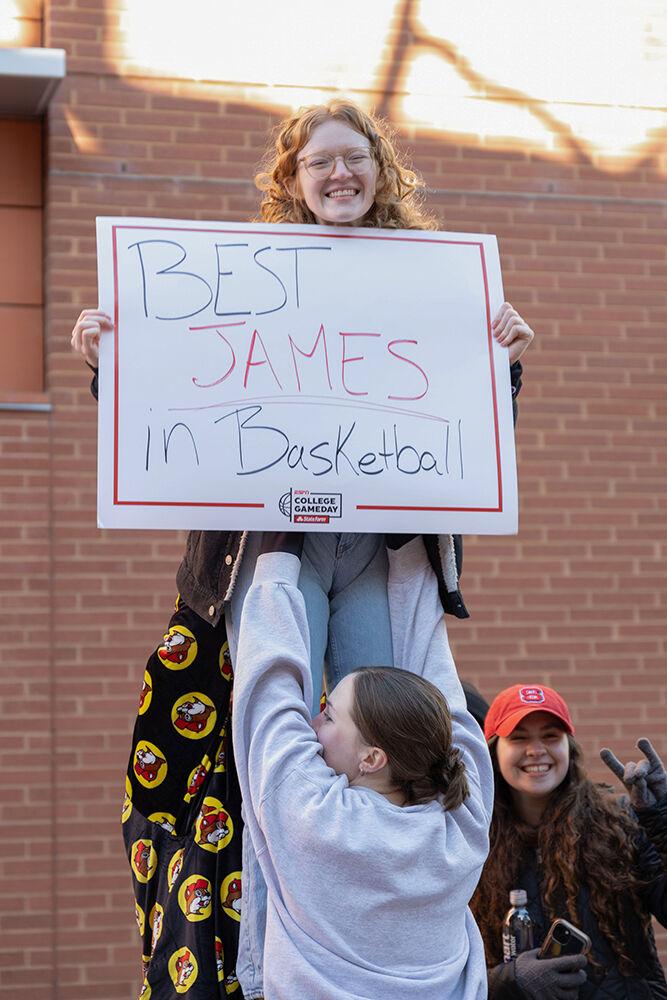 Anna Kate, a second-year studying biomedical engineering, smiles as she holds up her sign supporting Aziaha James before College GameDay outside Talley Student Union on Sunday, Feb. 23, 2025. Students lined up starting as early as 6:30 AM.