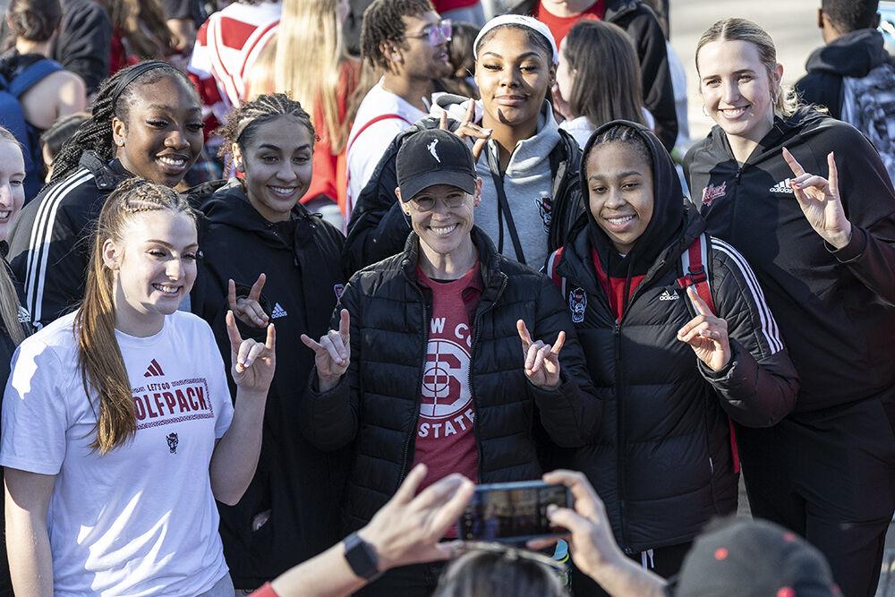 Members of the women's basketball team pose for a photo at the Memorial Belltower on Sunday, Feb. 23, 2025. Fans gathered to meet the team for a victory celebration after their game against Notre Dame, the AP ranked 1 team.