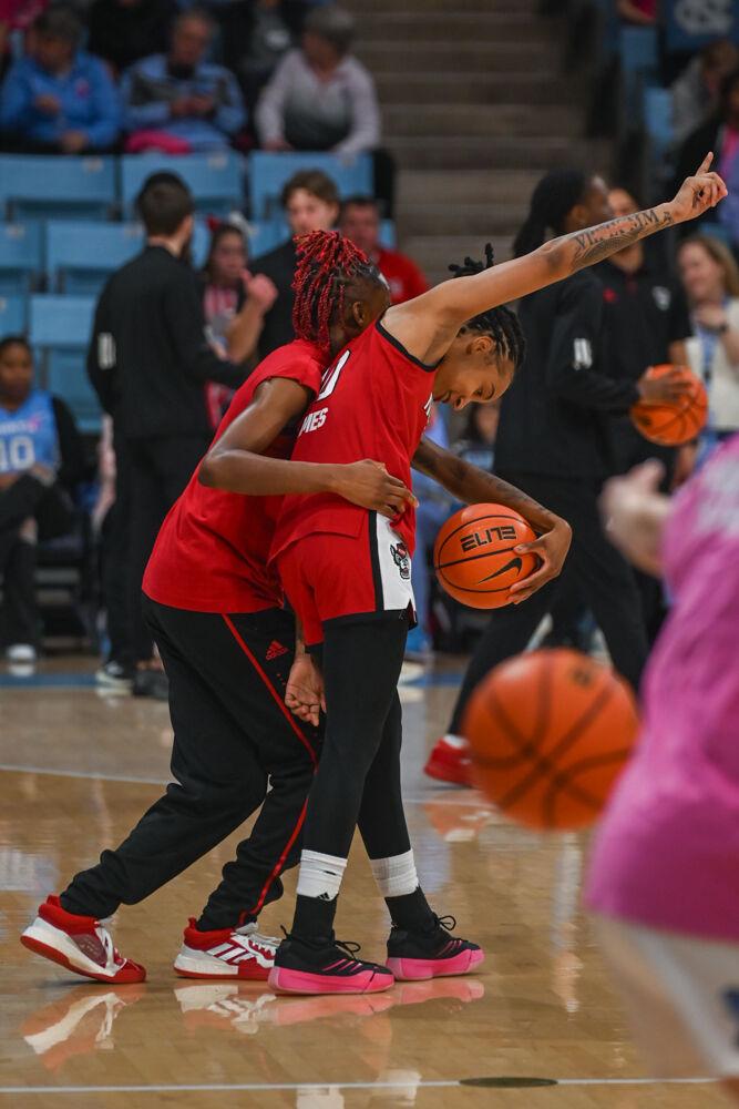 Senior guard Saniya Rivers and senior guard Aziaha James dance during warm-up before the game against UNC-Chapel Hill in Carmicheal Arena on Sunday, Feb. 16, 2025. NC State lost to Chapel Hill 66-65.
