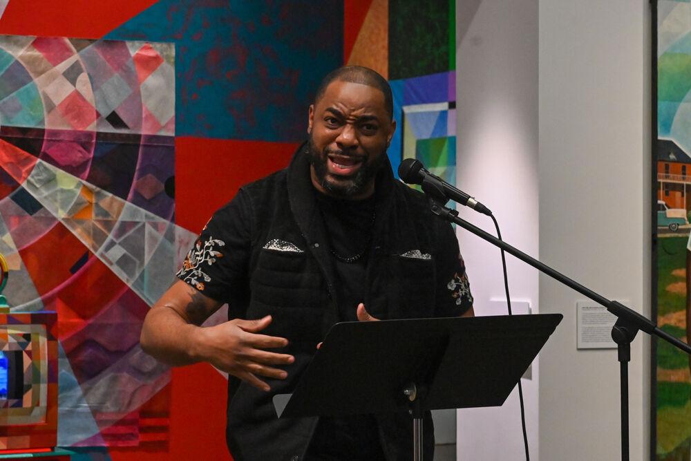 Poet Eric Thompson performs spoken word poetry at an opening exhibition by Carl Joe Williams at the Gregg Museum of Art &amp; Design on Thursday, Feb. 6, 2025. Williams' immersive exhibition titled "Amazing Grace" explores the complexities of race as a social construct.