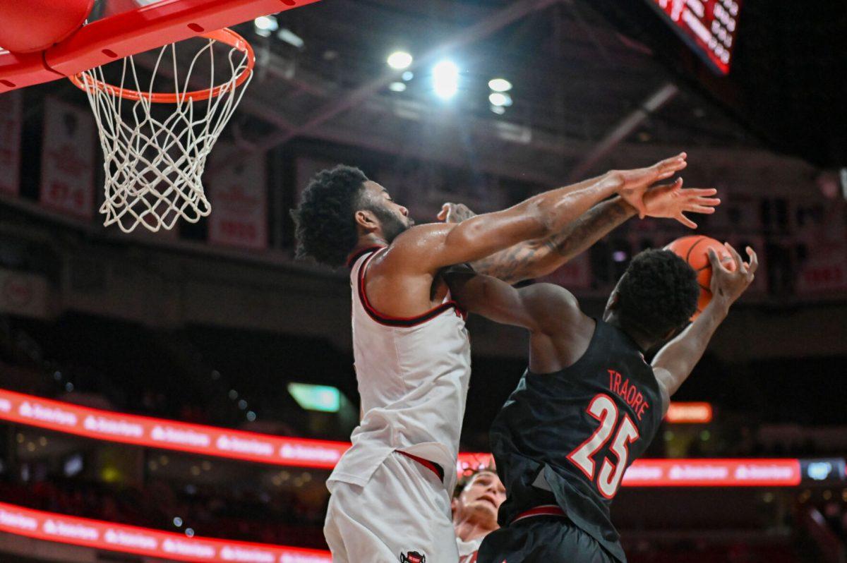 Senior guard/forward Dontrez Styles blocks a shot during the game against University of Louisville at the Lenovo Center on Wednesday, Feb. 12, 2025. Styles had both a block and a steal as well as three assists. NC State lost 91-66.