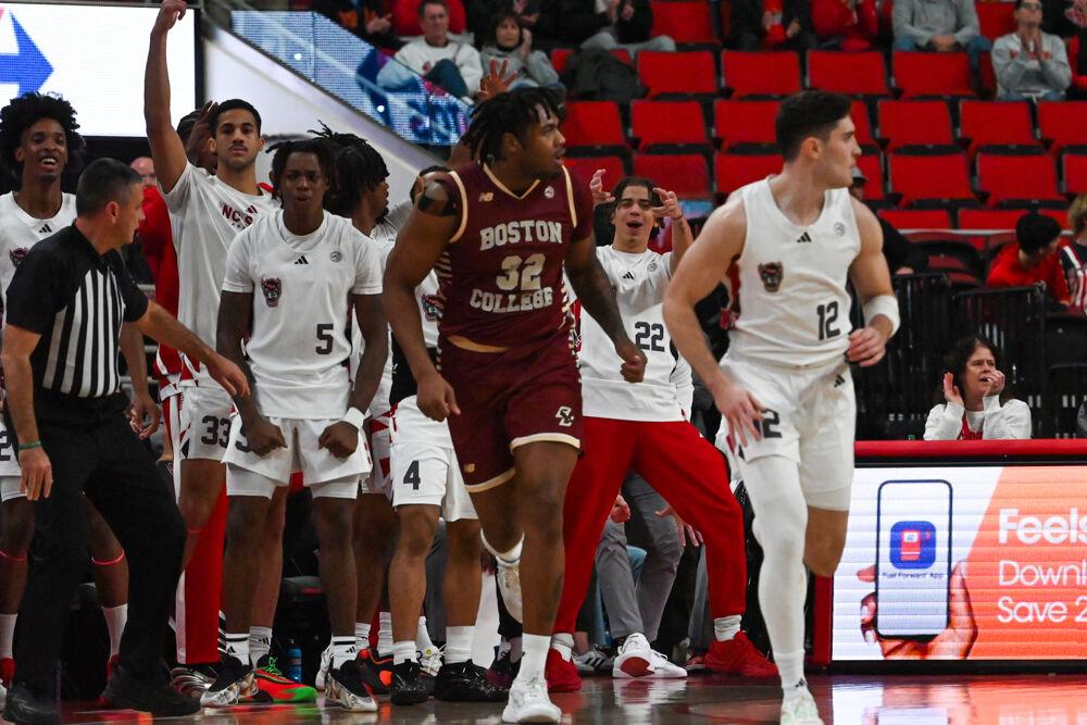 Junior forward Isma&#235;l Diouf, freshman guard Trey Parker and junior guard Jordan Snell celebrate after graduate Michael O'Connell scores during the game against Boston College in the Lenovo Center on Saturday, Feb. 15, 2025. O'Connell had six points. NC State beat Boston College 70-62.