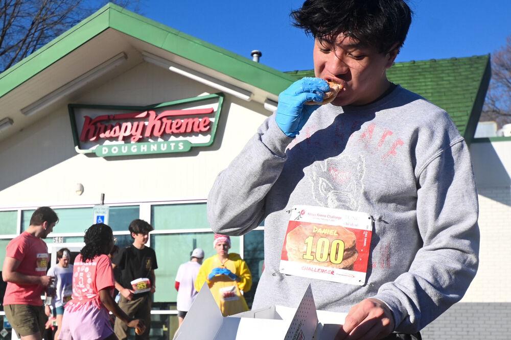 Daniel Cao, a fourth-year in computer science, finishes his dozen of donuts during the Krispy Kreme Challenge at Krispy Kreme in Downtown Raleigh on Saturday, Feb. 1, 2025. Participants ran 5-miles round-trip, and ate a dozen donuts. Proceeds are donated to the UNC Children's hospital.