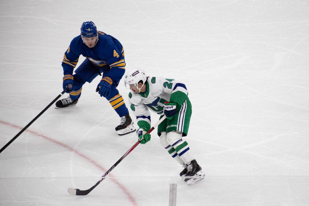 Center Seth Jarvis skates past a defender during the Whalers Night game versus the Buffalo Sabres&#160;at the Lenovo Center on Thursday, Feb. 27, 2025. Jarvis scored one goal during the game. The Hurricanes beat the Sabres&#160;5-2.