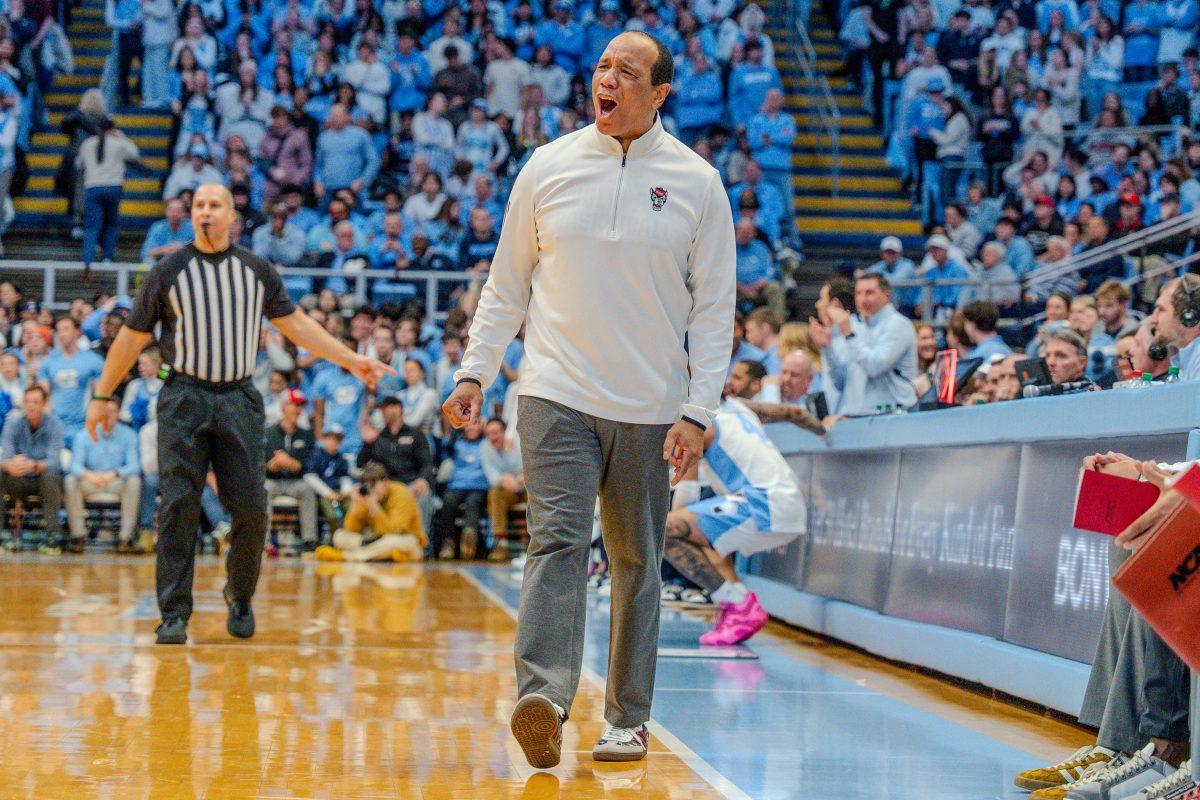 Coach Kevin Keatts shouts during the game against the University of North Carolina in the Dean E. Smith Center on Wednesday, Feb. 19, 2025. NC State lost the game 97-73.