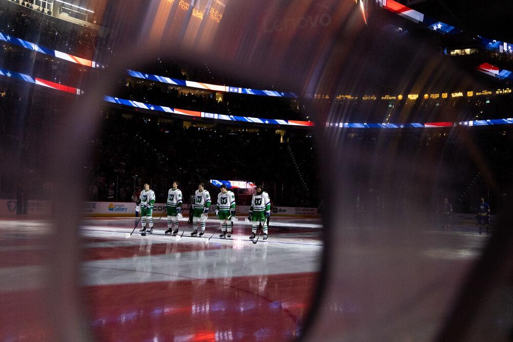 The Carolina Hurricanes' starting five stand for the national anthem during the Whalers Night game versus the Buffalo Sabres at the Lenovo Center on Thursday, Feb. 27, 2025. The Hurricanes beat the Sabres&#160;5-2.