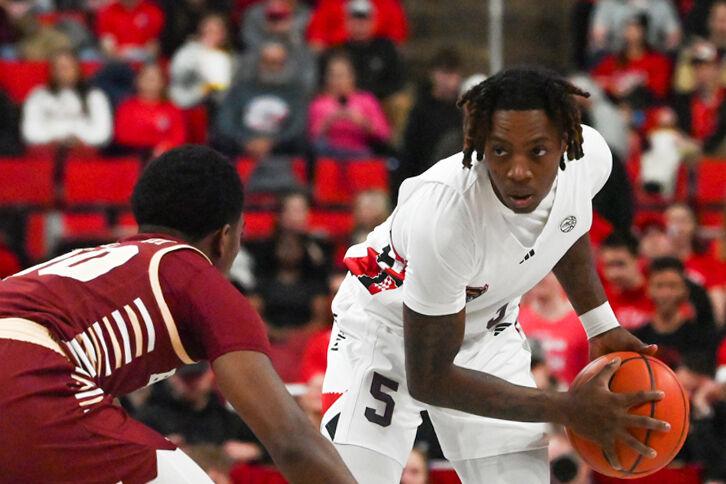 Freshman guard Trey Parker swings the ball during the game against Boston College in the Lenovo Center on Saturday, Feb. 15, 2025. Parker had three points. The Wolfpack beat the Eagles 70-62.