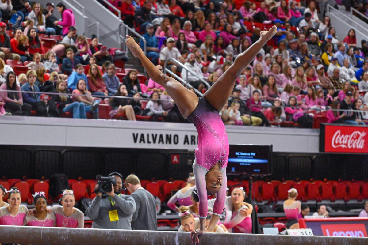 Sophomore Ashley Knight preforms a flip on the balance beam during the meet against Pittsburgh at Reynolds Coliseum on Saturday, Feb. 8, 2025. Knight recorded a 9.700 on the balance beam. NC State beat Pittsburgh 196.475-193.600.