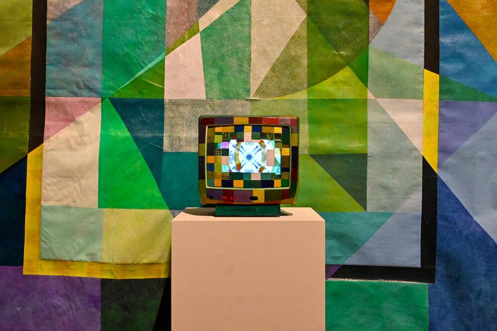 A television with various colored squares display images at an opening exhibition by Carl Joe Williams at the Gregg Museum of Art &amp; Design on Thursday, Feb. 6, 2025. Williams' immersive exhibition titled "Amazing Grace" explores the complexities of race as a social construct.