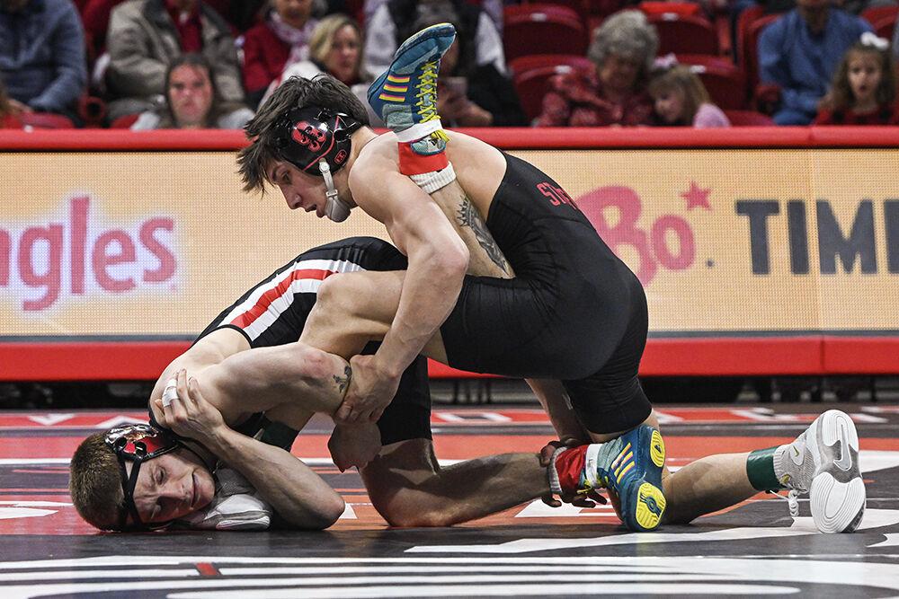 Redshirt senior Kai Orine holds his opponent's leg during the duel against Stanford in Reynolds Coliseum on Friday, Feb. 14, 2025. Orine lost the 133 bout 9-1. NC State beat Stanford 27-13.