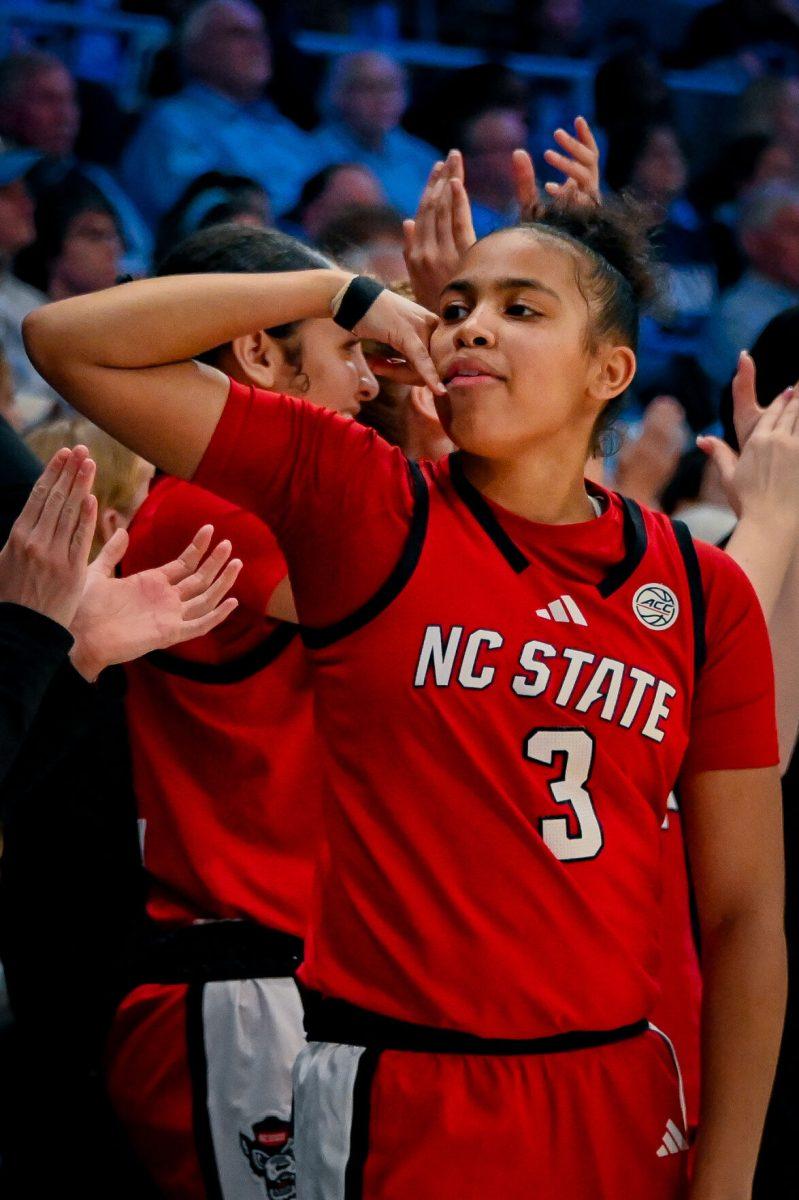 Freshman guard Zamareya Jones celebrates after scoring for the Wolfpack during the game against the Tar Heels in Carmichael Arena on Sunday, Feb. 16, 2025. Jones has totaled 152 points this season. The Wolfpack lost to the Tar Heels 66-65