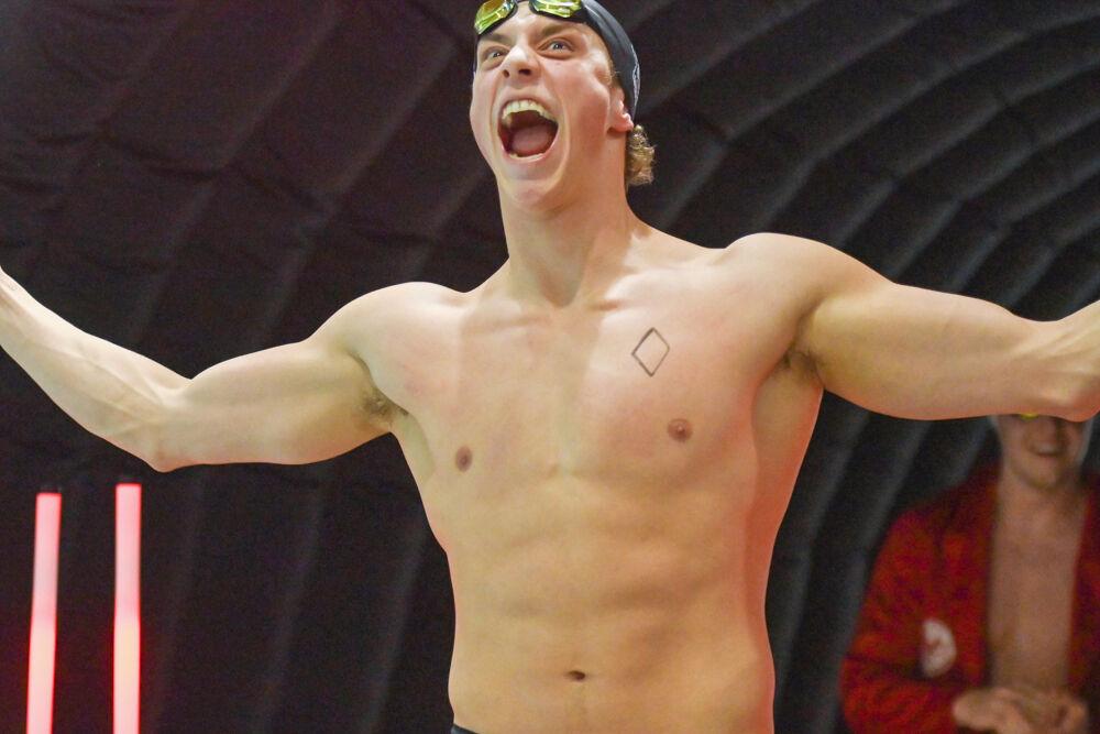 Sophomore Jerry Fox cheers walking out of the tunnel during the meet against UNC-Wilmington in the Casey Aquatic Center on Friday,&#160;Jan. 31, 2025. The Wolfpack beat the Seahawks 161-114.