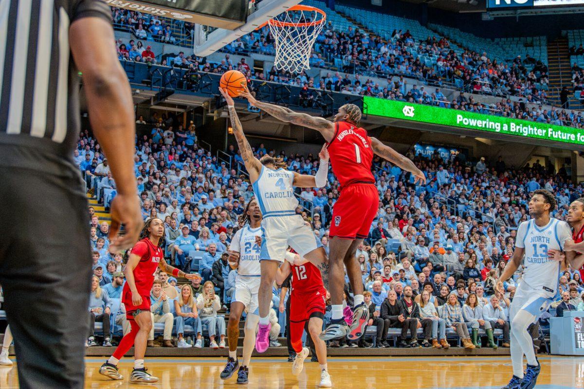 Senior forward Brandon Huntley-Hatfield blocks a layup during the game against the University of North Carolina in the Dean E. Smith Center on Wednesday, Feb. 19, 2025. Huntley-Hatfield scored two points and made one rebound. NC State lost the game 97-73.