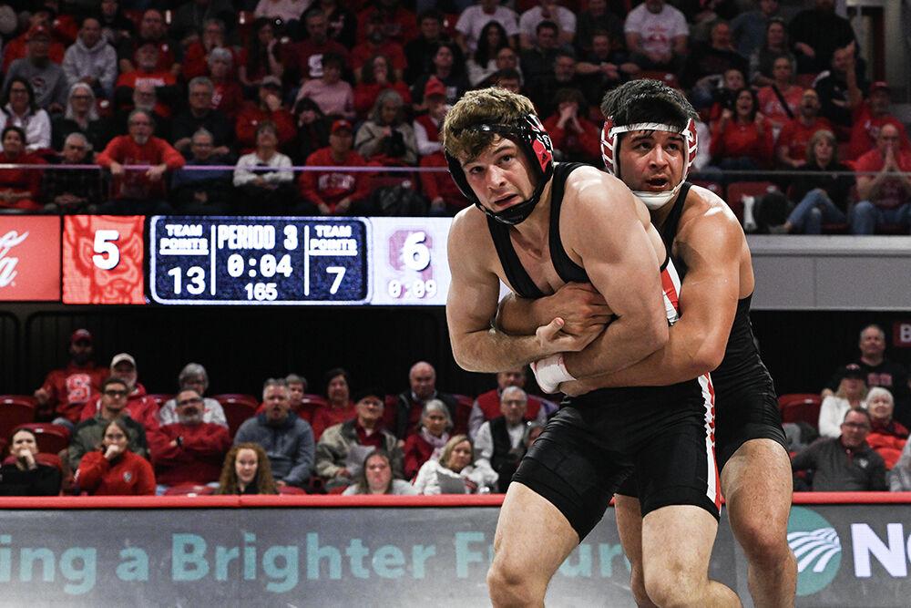 Redshirt junior Derek Fields attempts to escape his opponent during the duel against Stanford in Reynolds Coliseum on Friday, Feb. 14, 2025. Fields lost the 165 bout 6-5. The Wolfpack defeated the Cardinal 27-13.