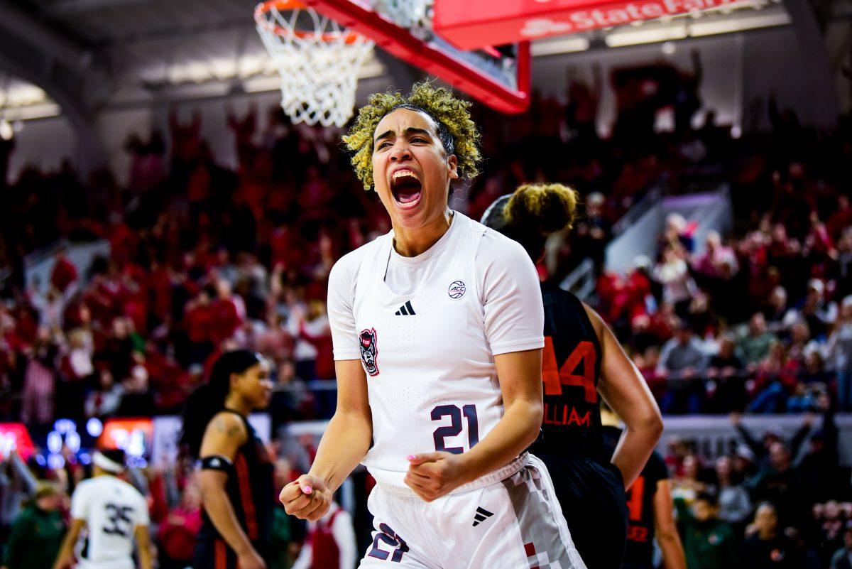 Senior guard Madison Hayes celebrates the final stop during the game against Miami in Reynolds Coliseum on Thursday, Feb. 13, 2025. Hayes led the team with 19 points. The Wolfpack beat the Hurricanes 76-74.