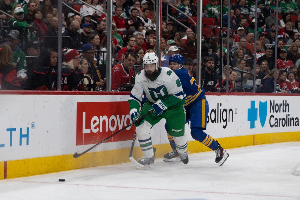 Defensemen Brent Burns eyes the puck during the Whalers Night game versus the Buffalo Sabres&#160;at the Lenovo Center on Thursday, Feb. 27, 2025. The Hurricanes beat the Sabres&#160;5-2.