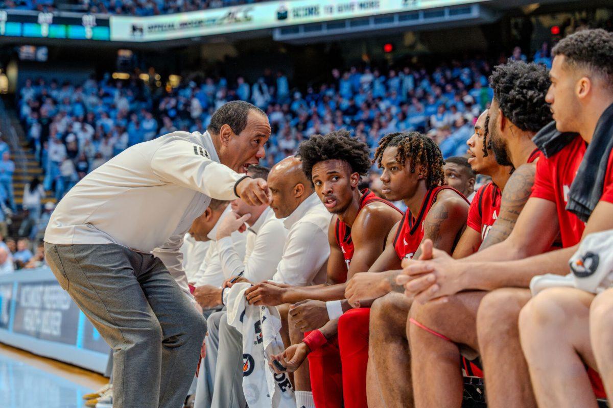 Coach Kevin Keatts shouts at his bench during the game against the University of North Carolina in the Dean E. Smith Center on Wednesday, Feb. 19, 2025. NC State lost the game 97-73.
