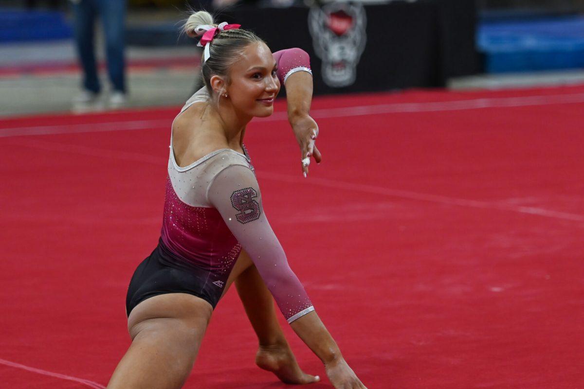 Sophomore Katie Harper poses during her floor routine during the meet against the University of Pittsburgh in Reynolds Coliseum on Saturday, Feb. 8, 2025. Harper completed her routine in exhibition during the meet. The Wolfpack beat the Pitt Panthers 196.475 to 193.600.