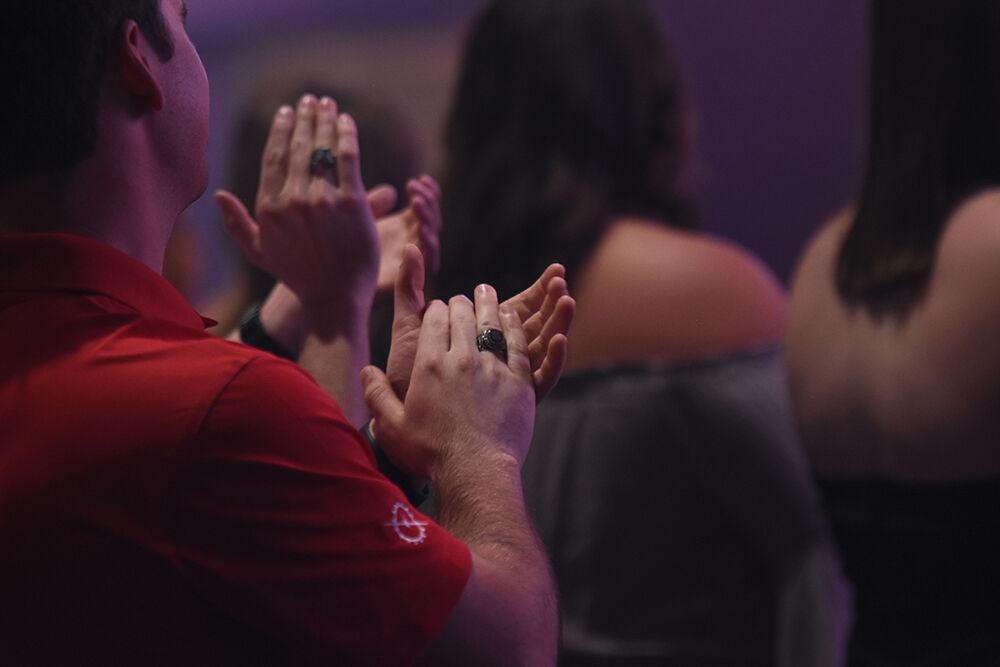 Students clap at the end of the Ring Ceremony after receiving their class rings in Reynolds Coliseum on Wednesday, April 27, 2022.