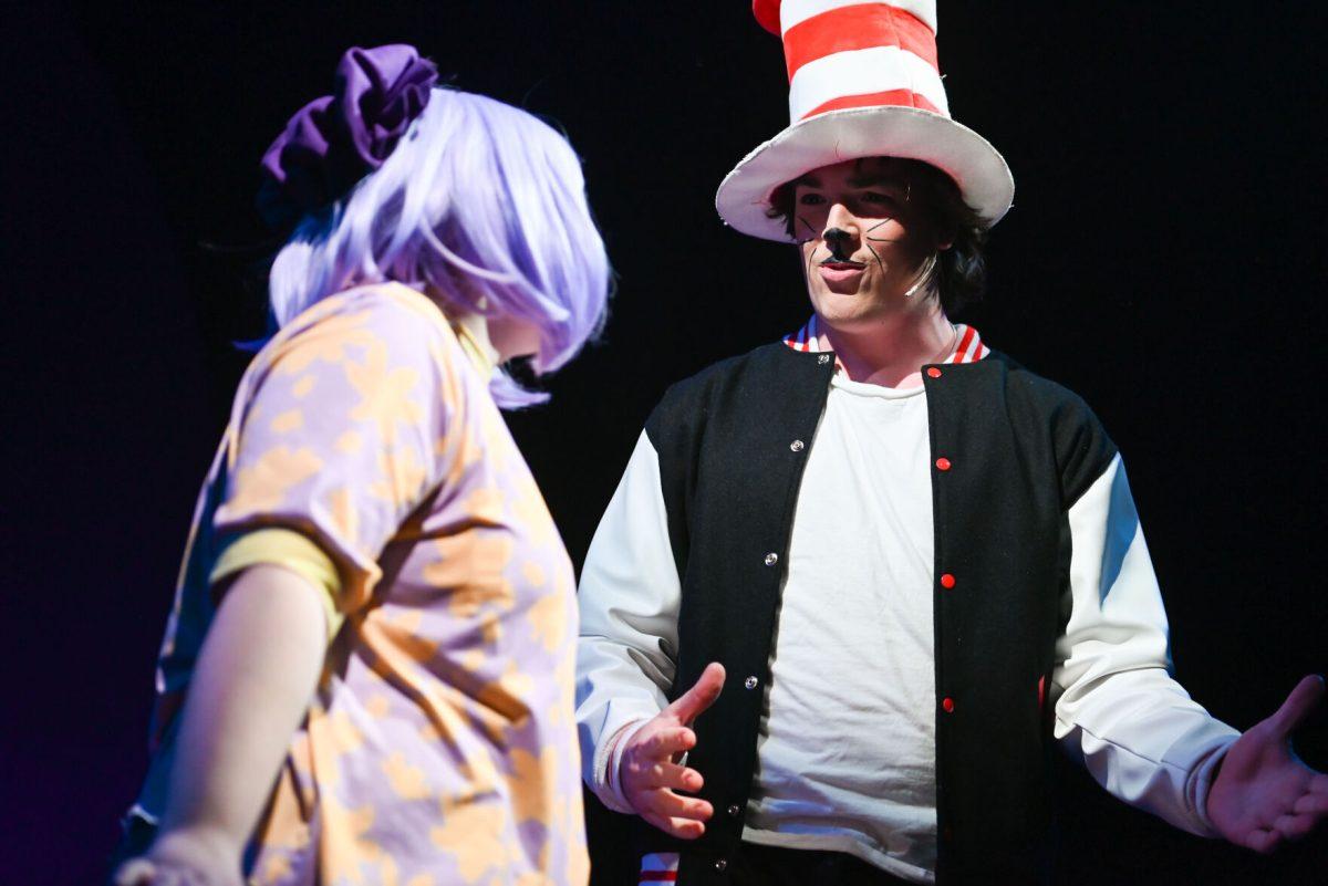 Alex Barr, a third-year studying psychology, performs as Jojo who looks at Owen Durso, a first-year studying nuclear engineering, performs as Cat in the Hat while he speaks during a performance of "Seussical" in Stewart Theater on Tuesday, Feb. 18, 2025. "Seussical" is runs from Feb. 20-23. The performance explores popular characters by popular children's book writer, Dr. Seuss.