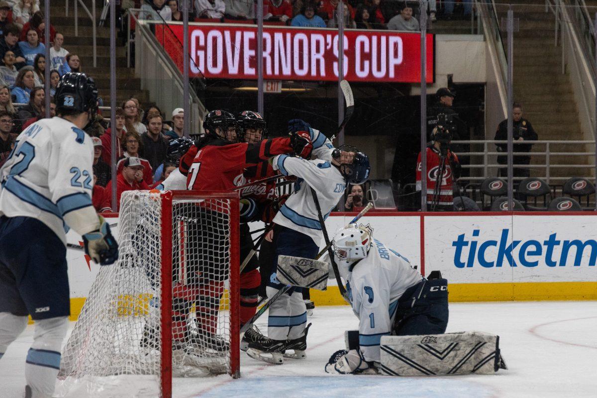 Sophomore forward Nick Shook punches Carolina&#8217;s Junior Defenseman Ben Edwards during the Governors Cup against the University of North Carolina at the Lenovo Center on Sunday, Feb. 2, 2025. The Wolfpack beat The Tarheels 4-1.