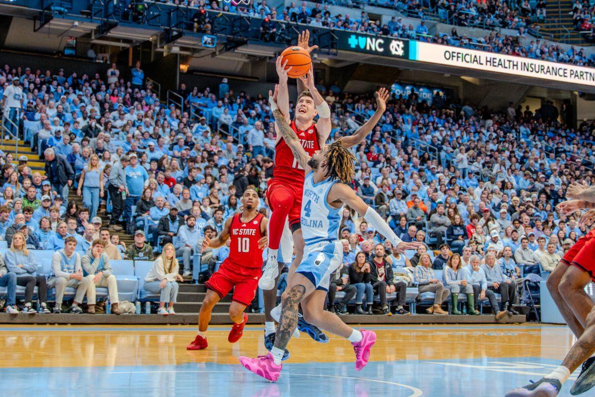 Graduate guard Michael O'Connell attempts a layup during the game against the University of North Carolina in the Dean E. Smith Center on Wednesday, Feb. 19, 2025. O'Connell scored eight points and made two rebounds. NC State lost the game 97-73.
