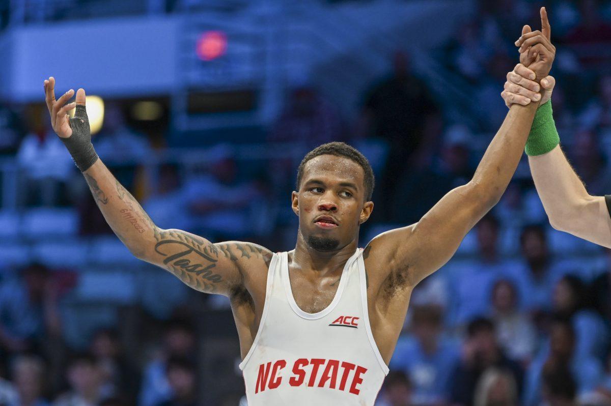 Redshirt freshman Vince Robinson celebrates his win during the wrestling match against UNC-Chapel Hill in Carmichael Arena on Friday, Jan. 31, 2025. Robinson closed off the night with a win in the 125 weight class 10-3. NC State beat Chapel Hill 19-16.
