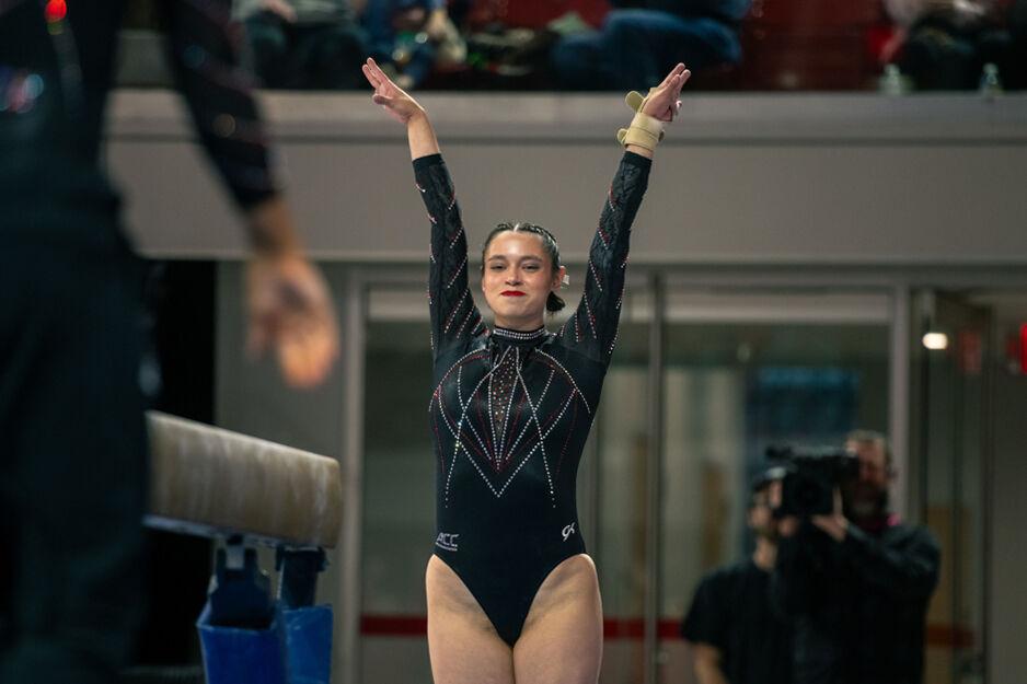 Graduate Chloe Negrete sticks the landing during the meet against California in Reynolds Coliseum on Sunday, Feb. 2, 2025. Negrete scored 9.900 points on the balance beam. The Wolfpack lost to the Bears 197.175-196.550