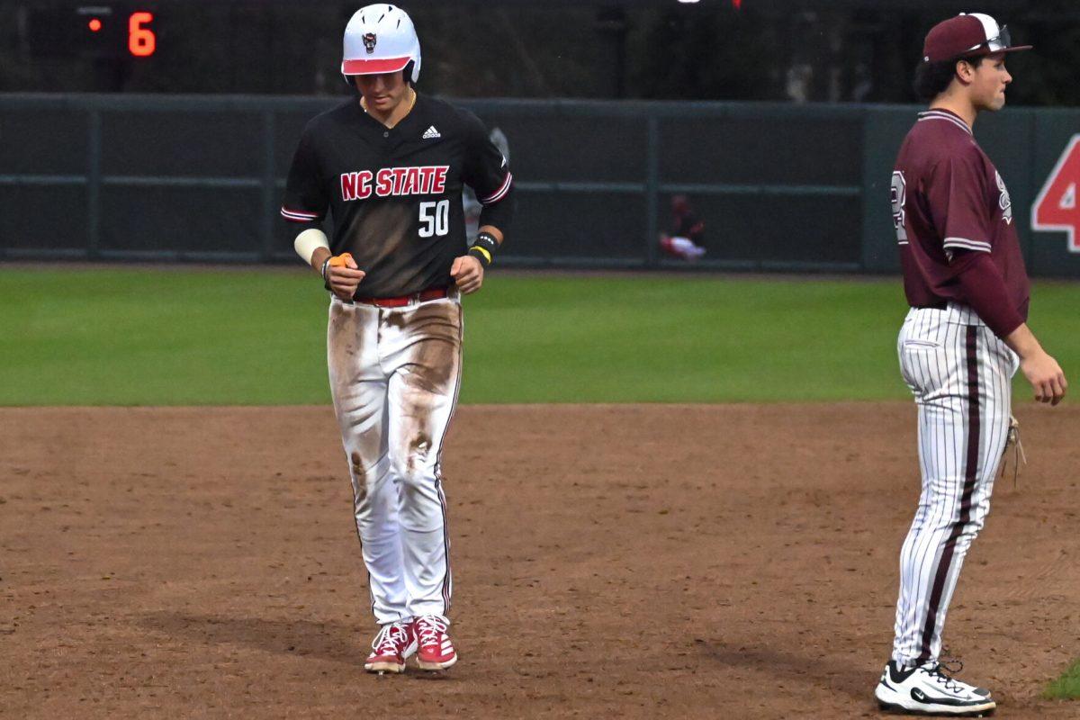 Freshman infielder Brandon Novy runs to third base during the game against Fordham on Feb. 15, 2025 at Doak Field at Dail Park. Novy scored one run. The Wolfpack defeated the Rams 19-6.